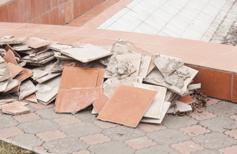 Tile Removal A pile of broken tiles removed from tile flooring demolition